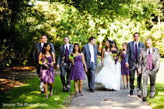 A lovely pair of hearts pose for pics with their bridal party.