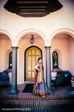 This Indian bride poses for lovely portraits before her wedding ceremony.