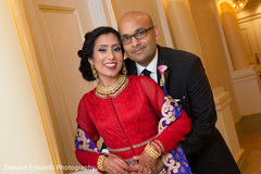 This Indian bride and groom celebrate at their wedding reception.