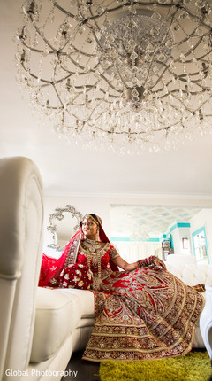 An Indian bride and her groom pose for wedding portraits!