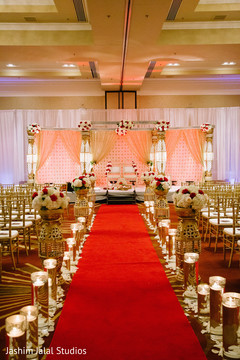 This Indian wedding ceremony features beautiful red and gold decor.