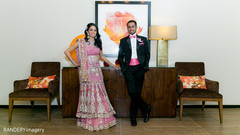 An Indian bride and groom celebrate with friends and family at their wedding reception!