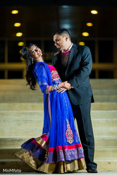 An Indian bride and groom celebrate at their wedding reception!