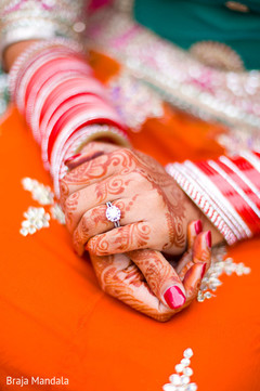 This Indian bride shows off her beautiful henna designs.