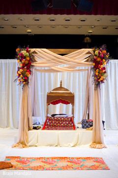 This Indian wedding ceremony includes a beautiful mandap.