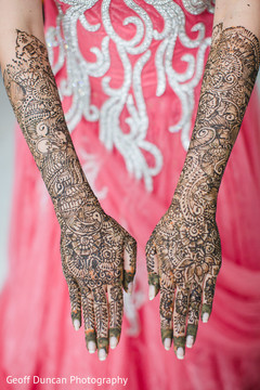 This Indian bride gets beautiful henna designs done for her wedding day.