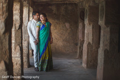 This Indian bride and groom pose for beautiful outdoor portraits before their wedding ceremony.