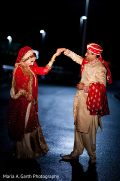 This Pakistani bride and groom celebrate at their wedding reception.