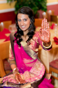 An Indian bride and groom celebrate at their pre-wedding celebrations.