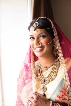 This Indian bride poses for beautiful portraits on her wedding day.