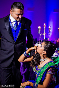 An Indian bride and groom celebrate at their reception in Cancun, Mexico!