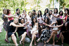 This Indian bride poses with guests at her bridal shower.