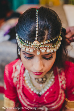 This Indian bride gets all dolled up for her wedding day.