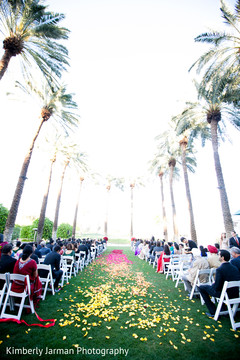 This Indian Christian ceremony includes a beautiful petal-scattered aisle.