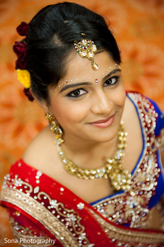 This Indian bride gets beautiful hair and makeup for her wedding day.