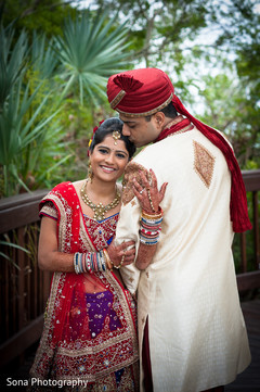 This Indian bride and groom pose for beautiful wedding portraits.