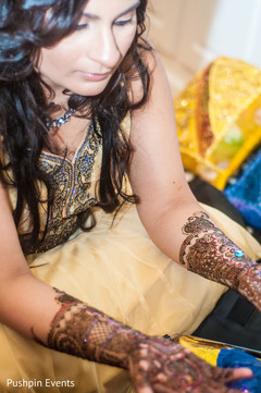 An Indian bride gets her mehndi done for her engagement celebrations!