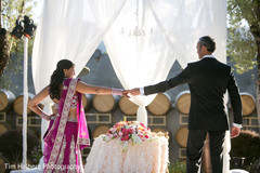 This bride and groom celebrate at their Indian wedding reception.