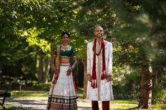 This Indian bride and groom pose for beautiful outdoor wedding portraits.