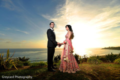 This Indian bride and groom pose for lovely outdoor reception portraits.