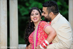 An Indian bride and groom pose for portraits before their reception!