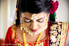 This Indian bride gets all dolled up for her wedding ceremony.