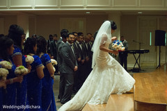 An Indian bride and groom wed in a traditional church wedding.