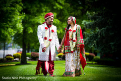 An Indian bride and groom pose for portraits at their wedding!