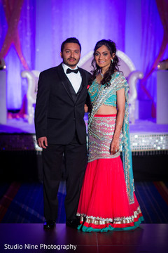 An Indian bride and groom celebrate at their wedding reception!