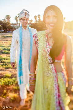 An Indian bride and groom bring a splash of color to their pre-wedding celebrations!