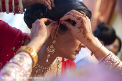 An Indian bride and groom get ready for their Sikh wedding ceremony.