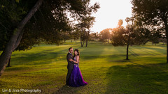 An Indian bride and groom pose for some darling wedding portraits.