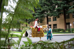 The groom arrives on a horse!