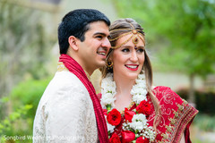 The couple takes outdoor portraits