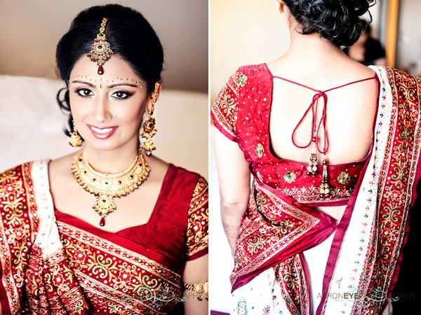 A beautiful Indian bride wears a traditional bridal outfit.