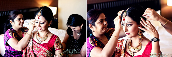 An Indian brides dresses in traditional Indian bridal jewelry.