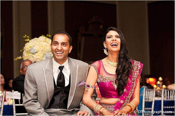 An Indian bride and groom enjoy their Indian wedding reception in Fairfax, Virginia.