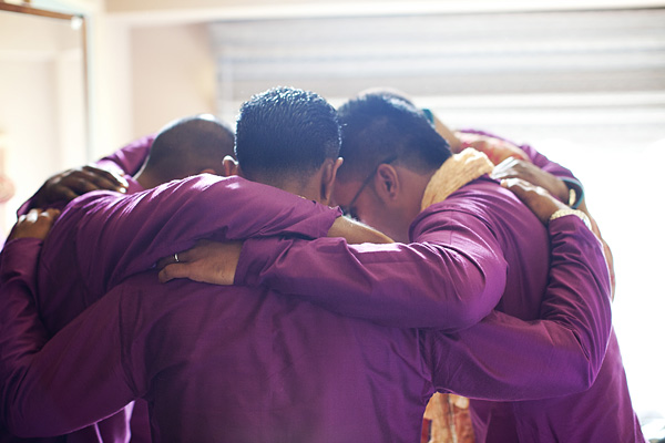 The groomsmen make a huddle before the Indian wedding march begins.