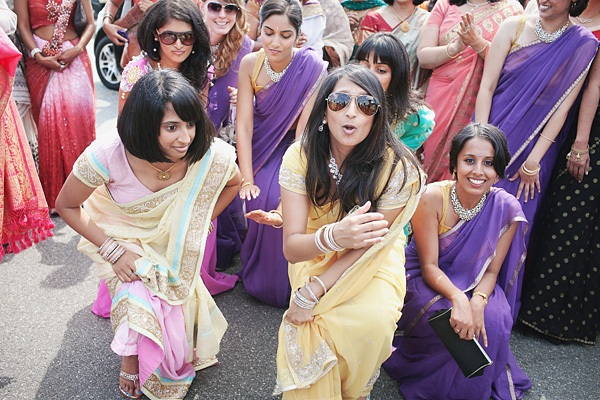 The bridal party welcomes the groomsmen at the start of this Indian wedding.