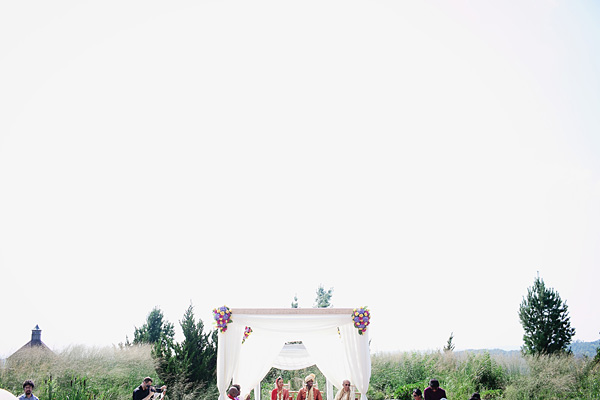 Indian wedding photography captures the lovely scene of this outdoor affair.