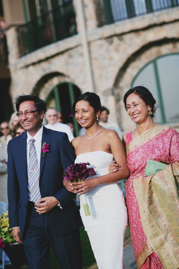 An Indian bride wears a white wedding gown at her fusion Indian wedding.