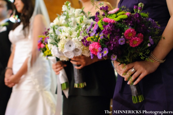 indian bridesmaids hold colorful bouquets at this indian fusion wedding.