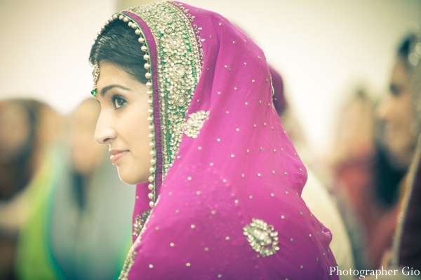 A Sikh Indian bride in a hot pink wedding sari.