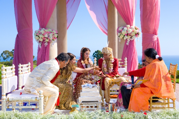 Indian bride and groom wed in an outdoor Indian wedding ceremony.