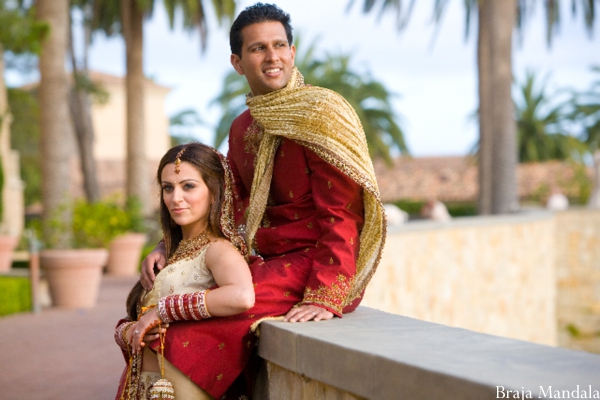 An Indian bride and groom at their outdoor indian wedding.