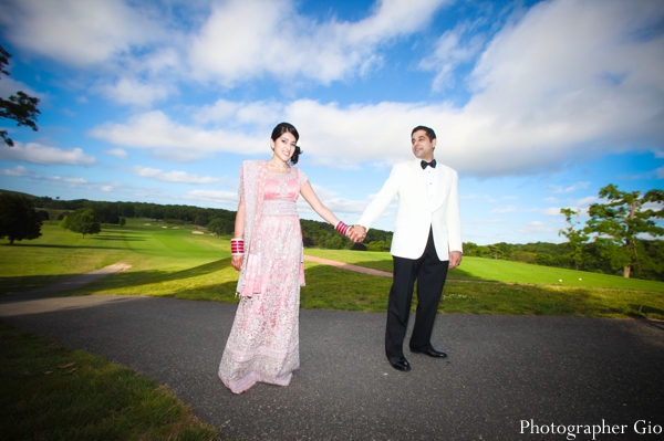 An Indian bride and groom take professional Indian wedding photography before the reception.