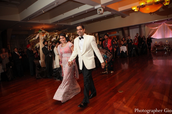 Indian bride and groom enter their hollywood theme wedding reception.