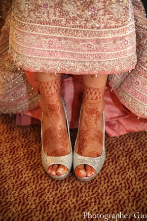 Closeup of bridal mehndi on feet on an indian bride.