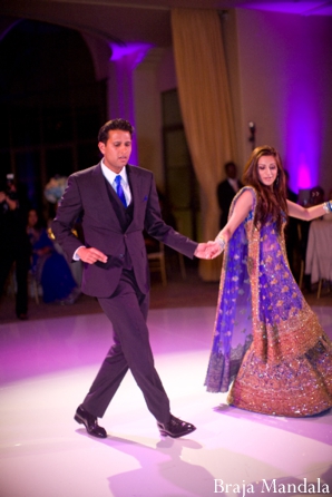 An indian wedding reception in purple and gold.