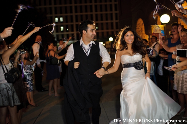 An indian bride and groom leave their indian wedding reception in dallas, texas.